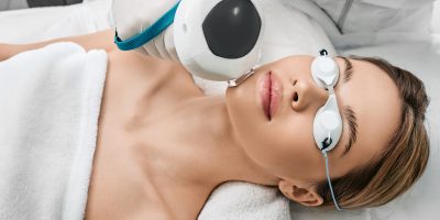 An adult woman receiving IPL treatment for sun spots at Tuscaloosa Medspa.