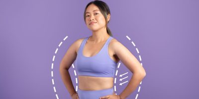 Woman in workout clothing representing body contouring candidacy and realistic results at a Tuscaloosa medspa.
